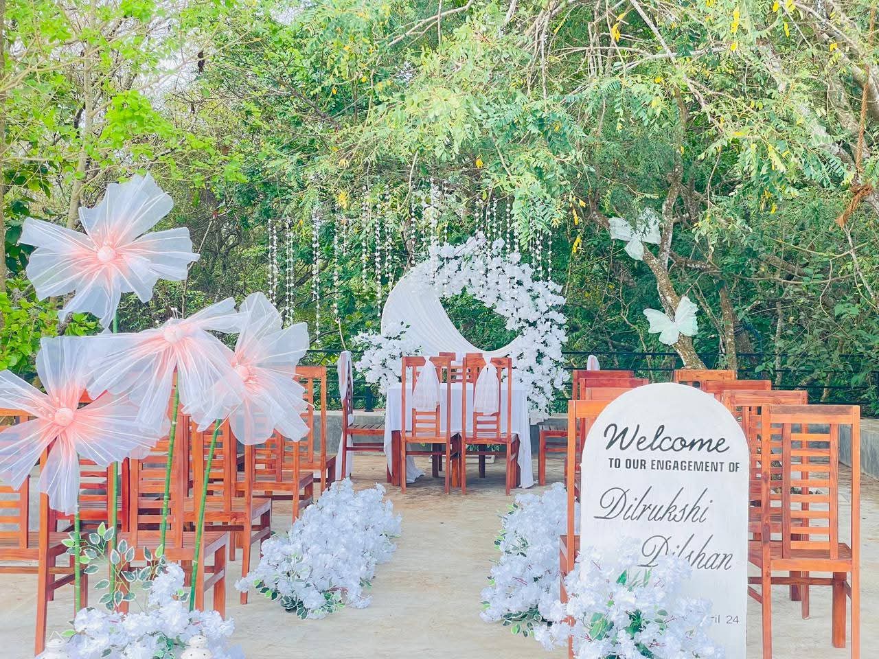 Outdoor engagement setup with paper flowers