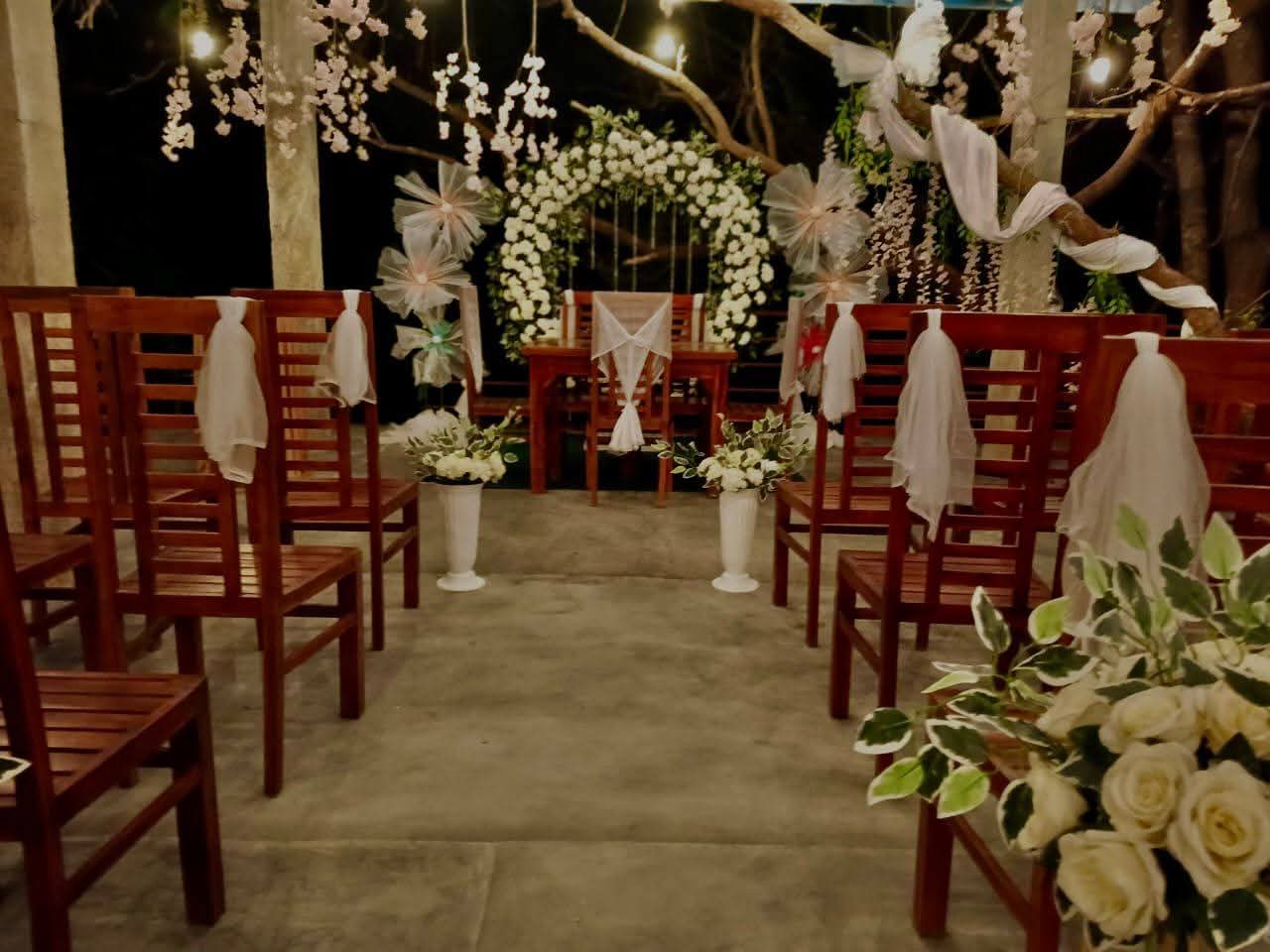 Evening wedding setup with white roses