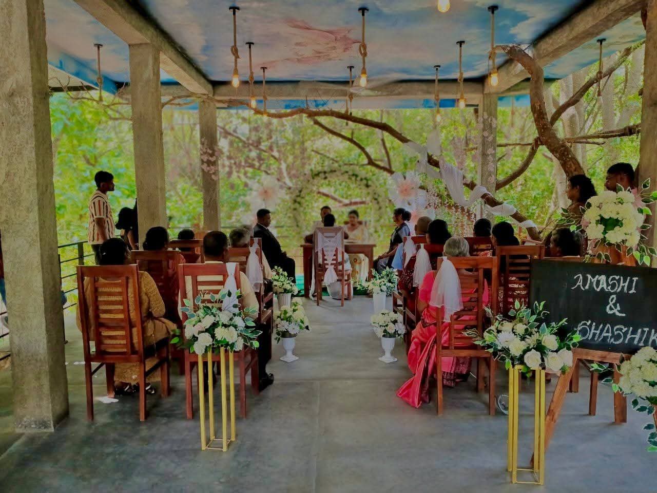 Wedding ceremony in progress with guests