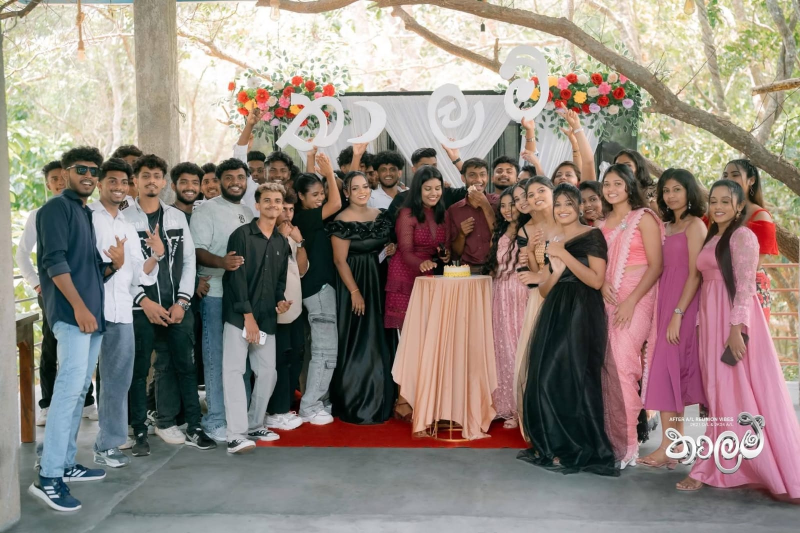 Large group celebration with cake