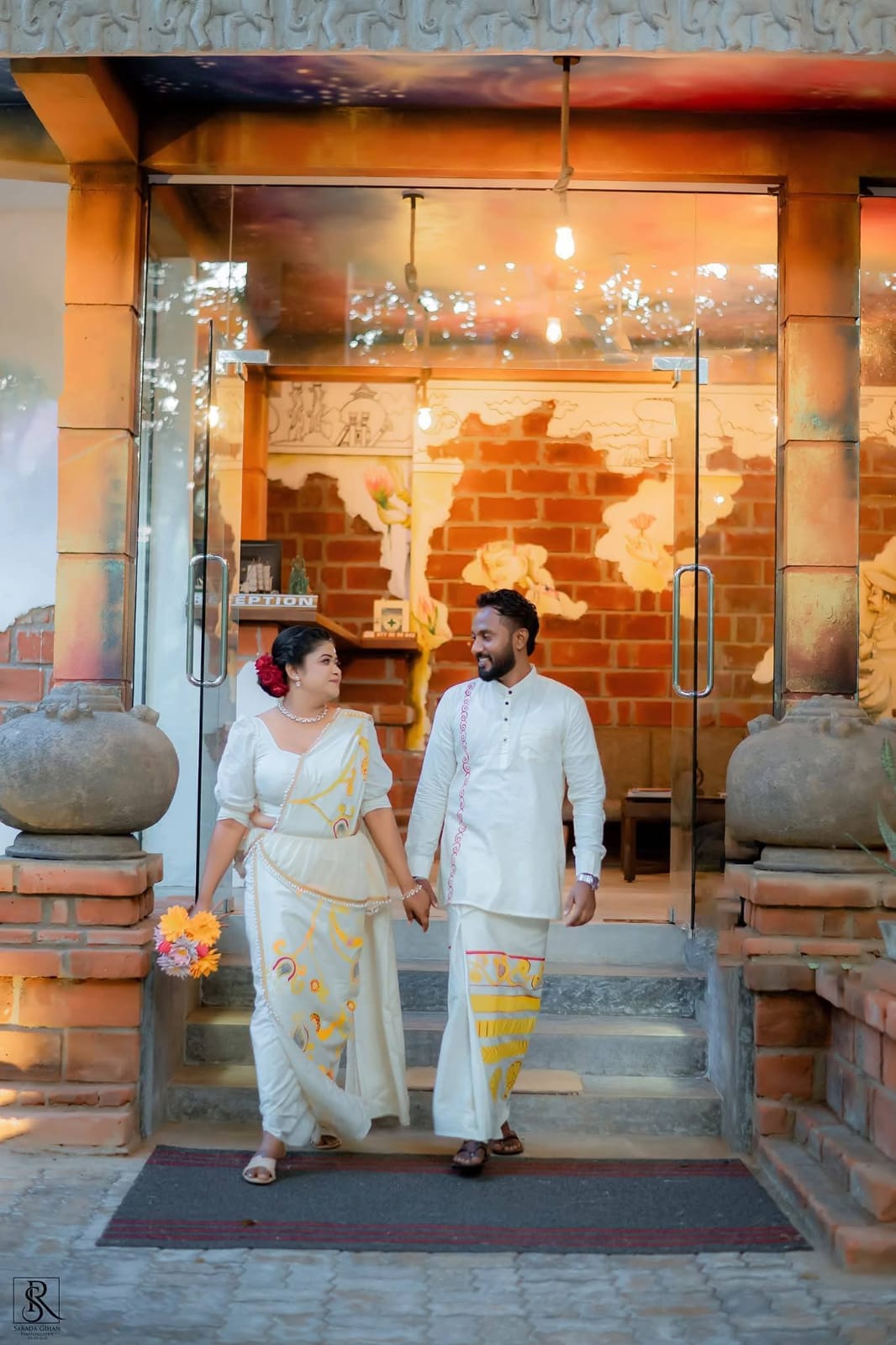 Couple in traditional dress at the entrance